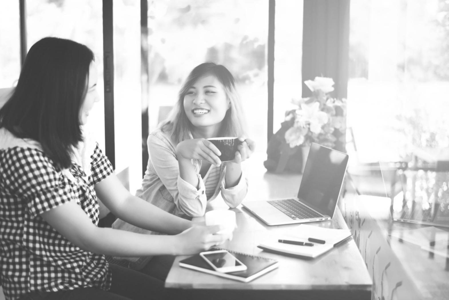 Students collaborating on coding projects in modern learning environment