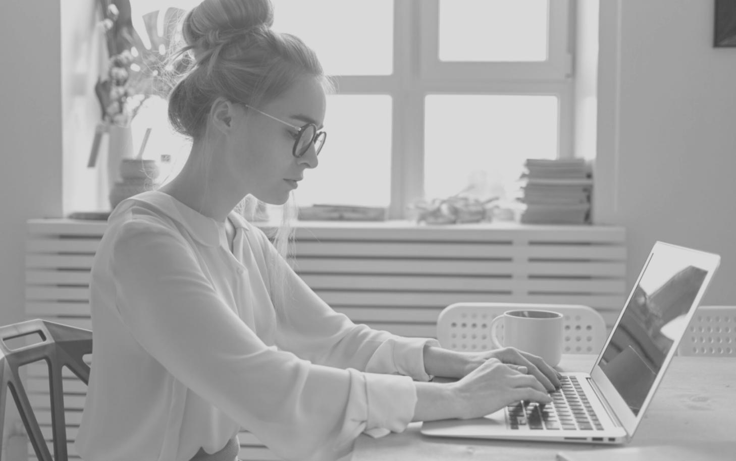WebDevCloudX students collaborating on group project with modern development tools and multiple monitors